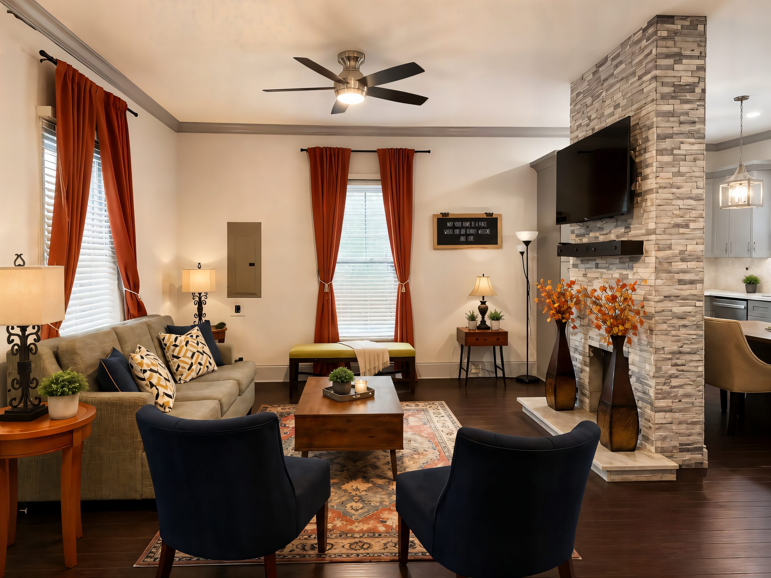 The shared living room at Arthur’s Place with a stone fireplace