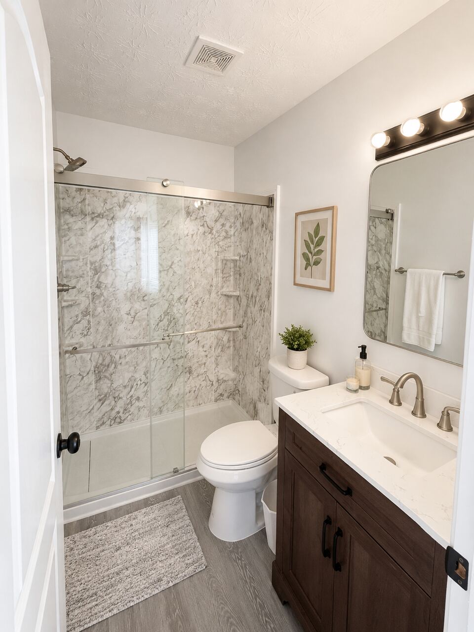 A private en suite bathroom with a wide vanity and mirror