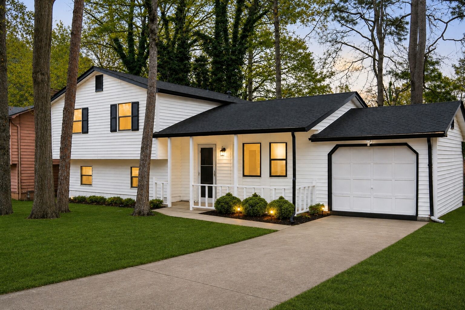 Zachary’s Place in Stone Mountain, Georgia, a white home with a garage and lawn